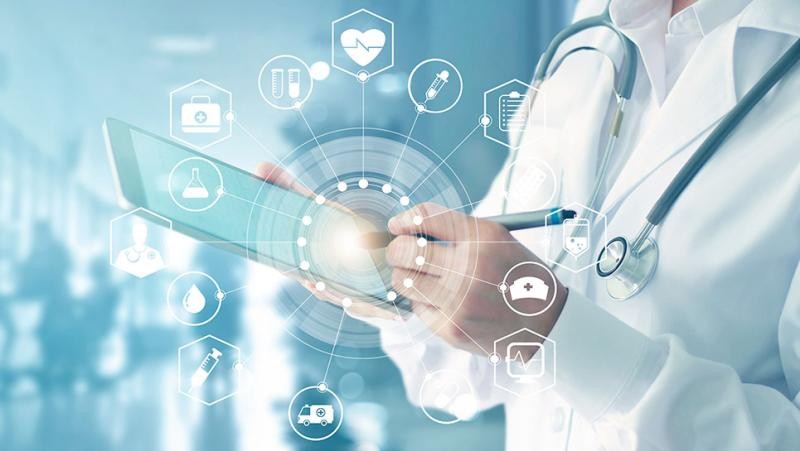 Doctor using tablet with healthcare technology integration icons